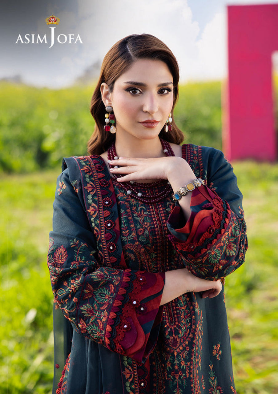Woman wearing a traditional embroidered outfit with a blurred outdoor background