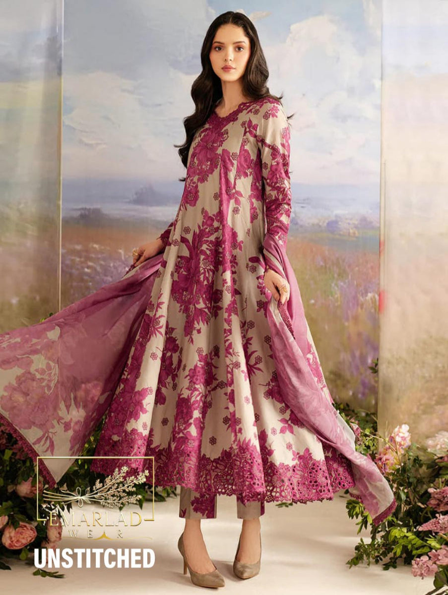 Woman wearing a pink and white floral dress with a matching dupatta against a scenic background.