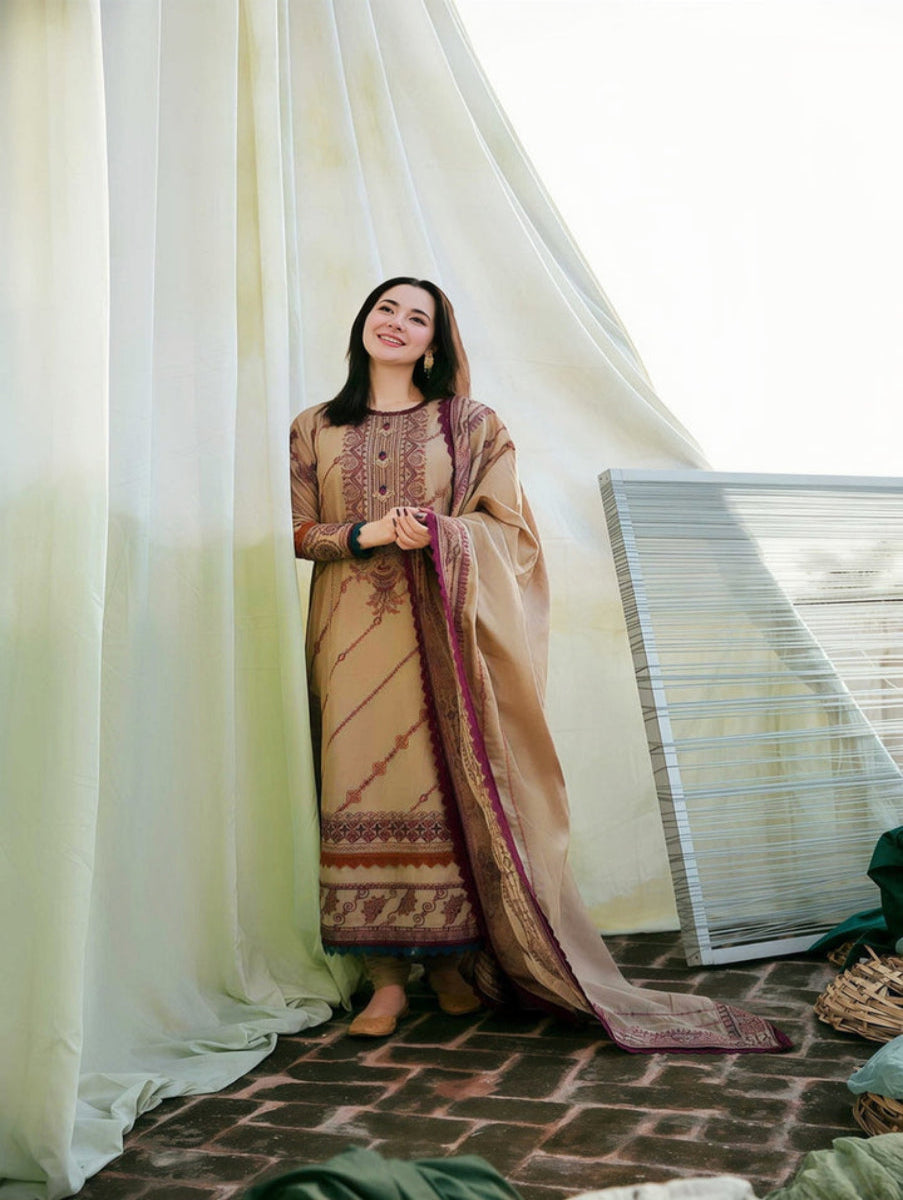 Woman in traditional embroidered dress standing indoors with a curtain and woven chair in the background