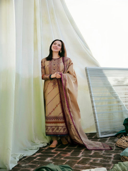 Woman in traditional embroidered dress standing indoors with a curtain and woven chair in the background